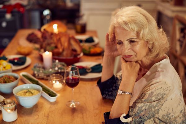 An elder woman upset at a dinner table. | Source: Getty Images