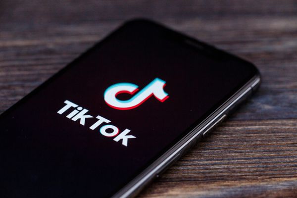 A phone showing the TikTok logo