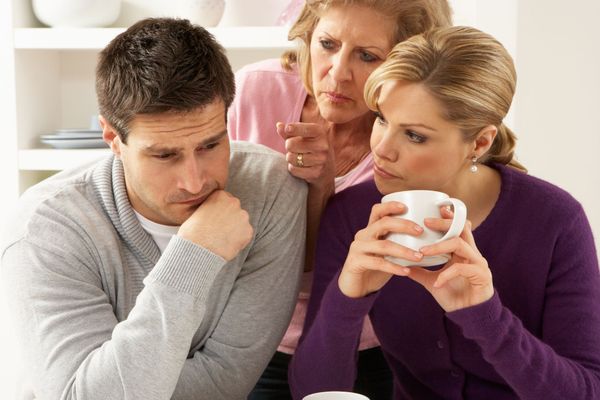 A couple and an older woman meddling in the conversation. | Source: Getty Images