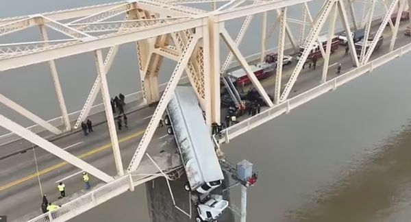 Brave Firefighter Rescues Woman Hanging From a Bridge