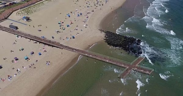 Outraged Citizens Demand Answers After Cross-Shaped Pier is Built on Public Beach