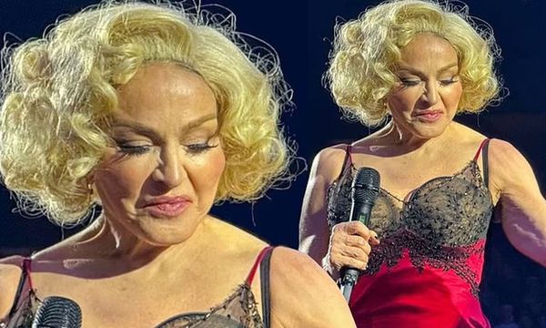 Madonna Takes The Stage Showing Her Muscles In A Skimpy Red Negligee