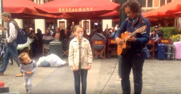 Young Girl Amazes Street Performer with Her Incredible Voice