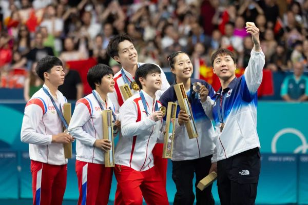 China's Wang Chuqin and Sun Yingsha (centre), North Korea's Ri Jong Sik and Kim Kum Yong (left), and South Korea's Lim Jonghoon and Shin Yu-bin (right). (Yao Yingkang/Zhejiang Daily/VCG via Getty Images)